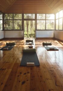 Mats, blankets, and soft lighting prepared for a Holotropic Breathwork session