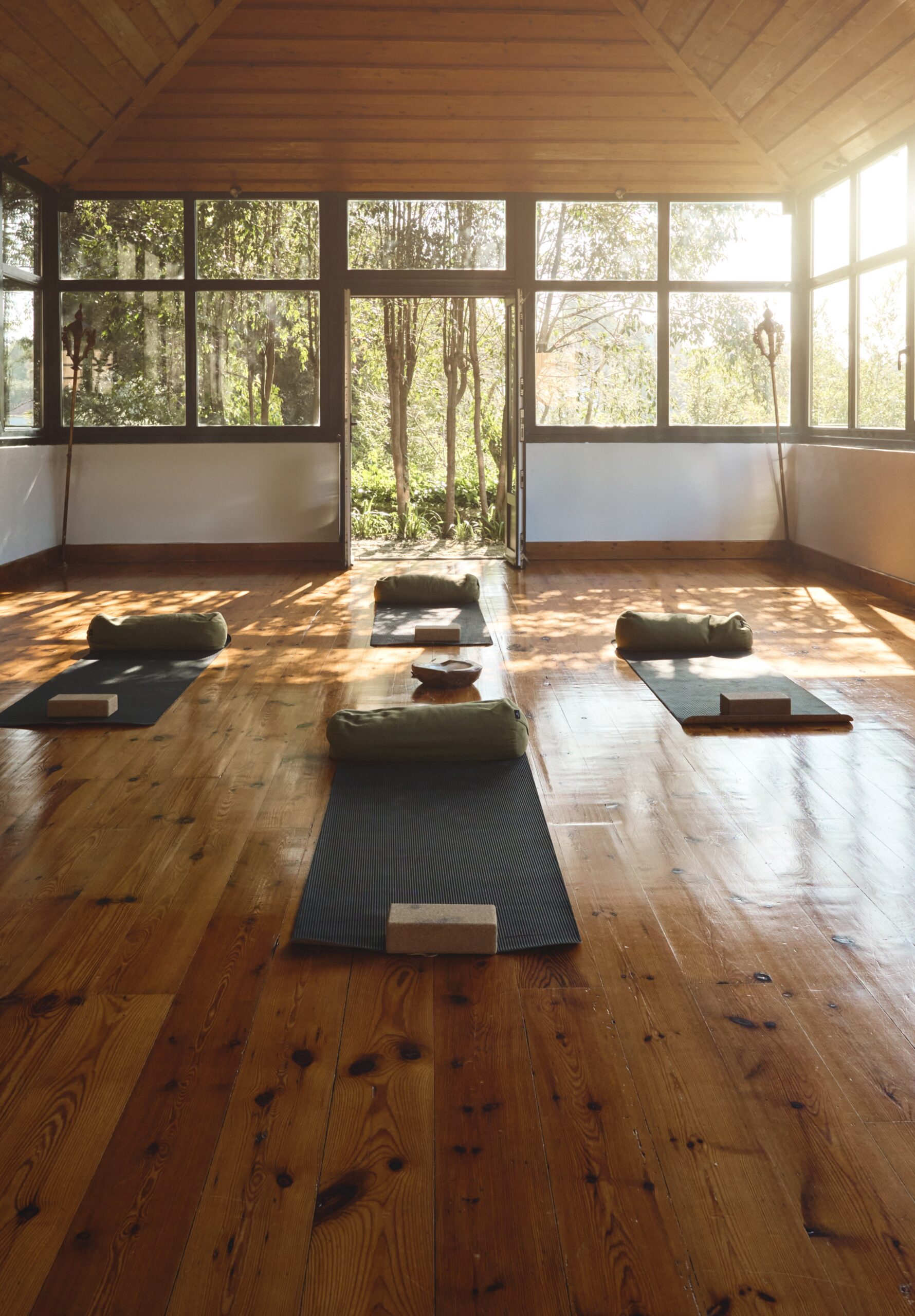 Mats, blankets, and soft lighting prepared for a Holotropic Breathwork session