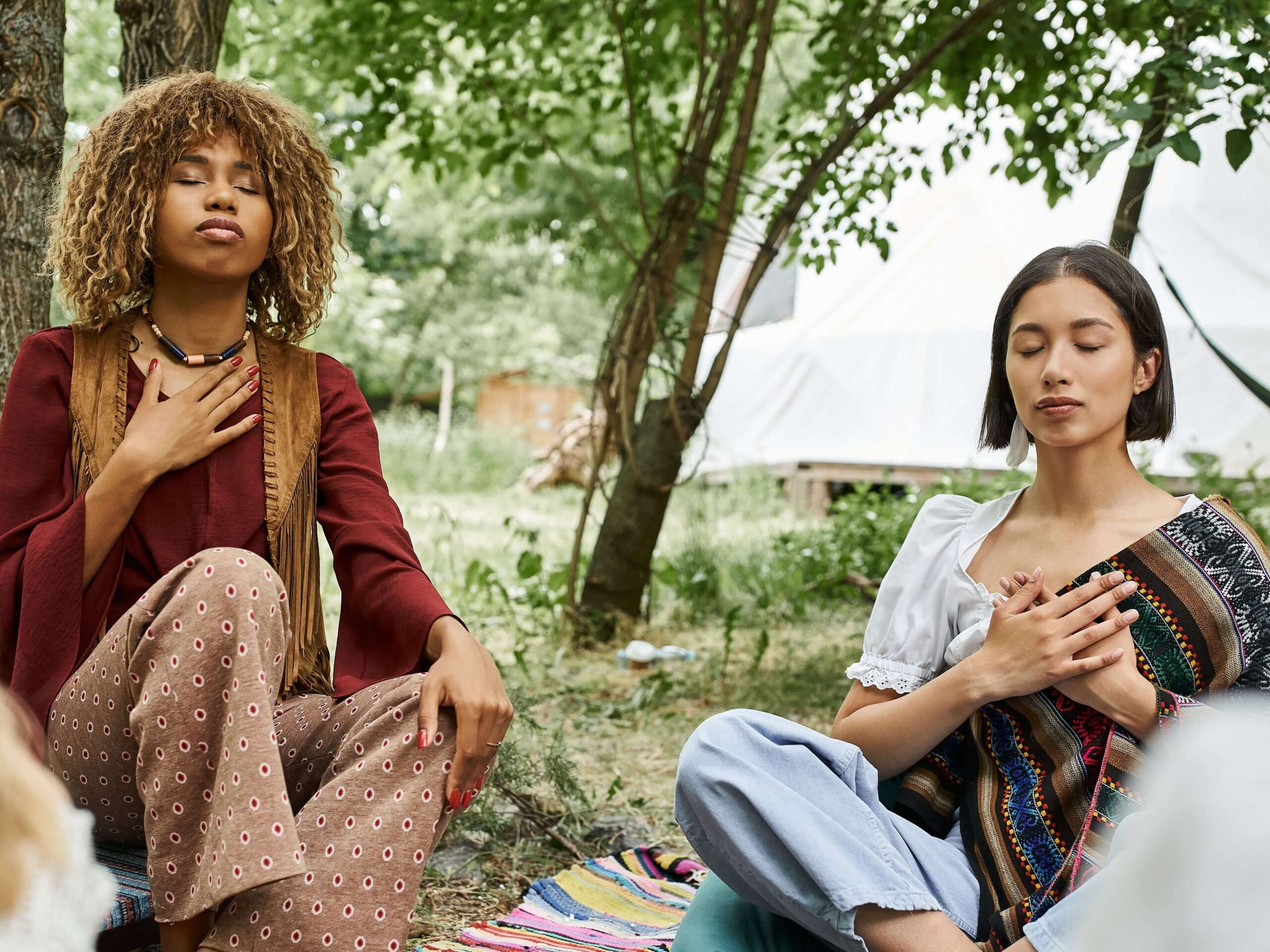 two women taking calming breath